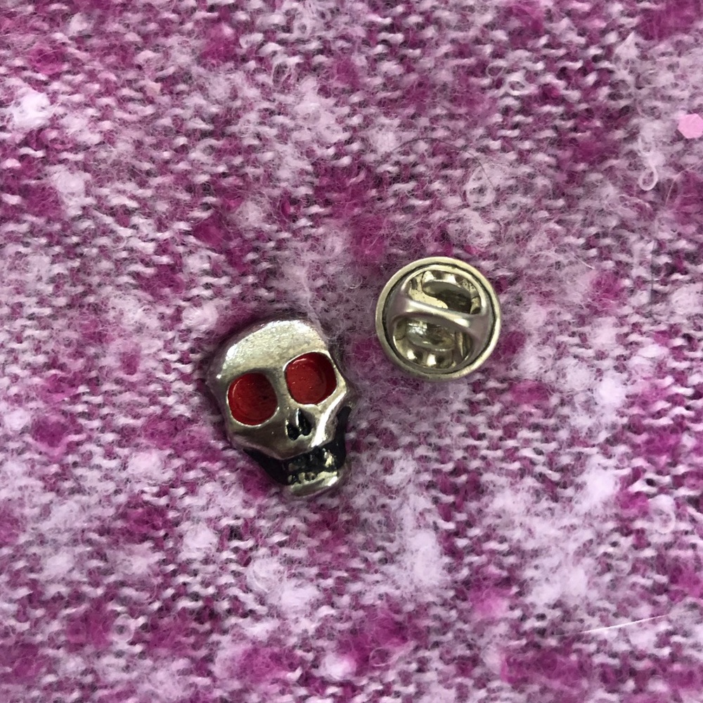 Vintage silver skull pin